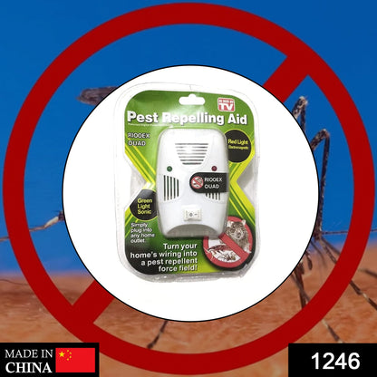 A single white pest repelling aid in its clear plastic and green cardboard packaging, against a blurry background.