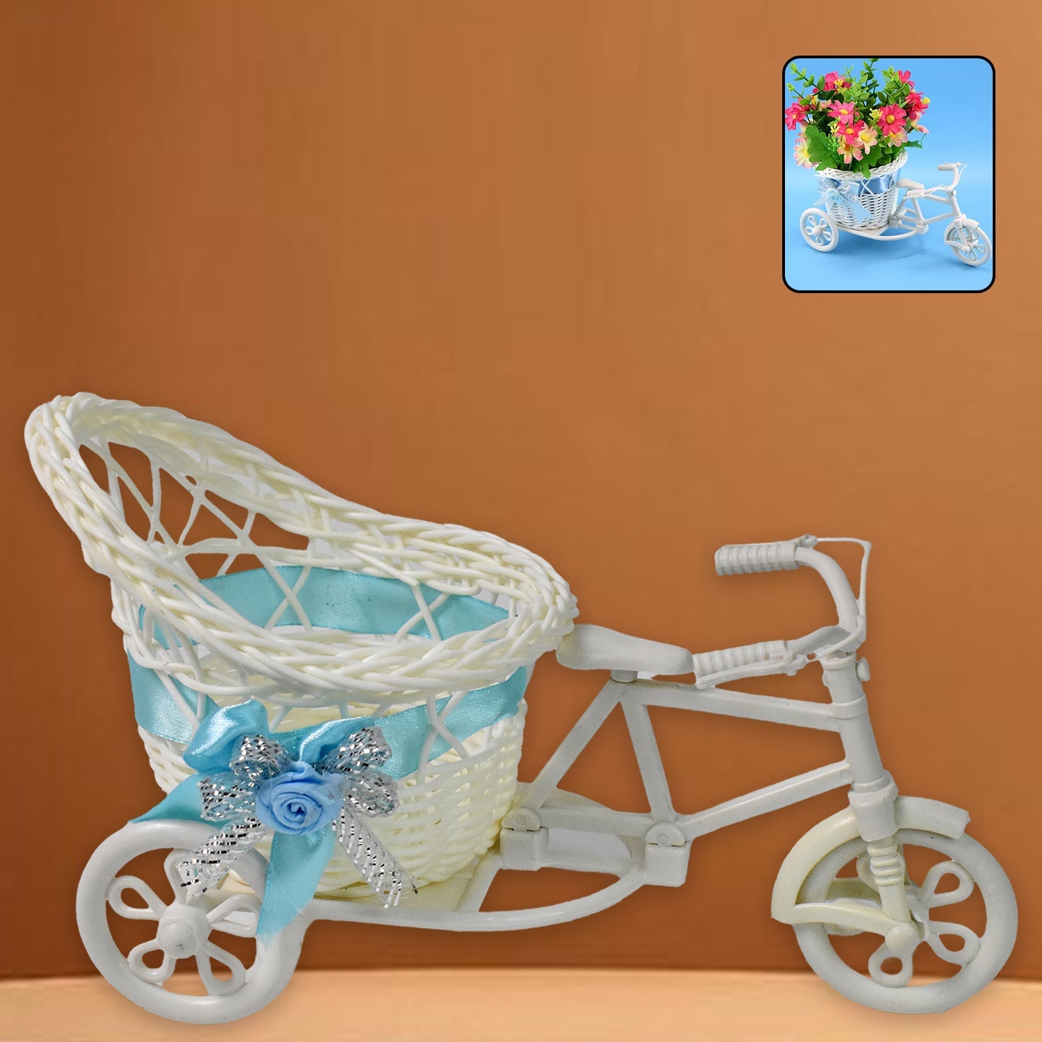 Decorative bicycle flower vase holding potted plants indoors