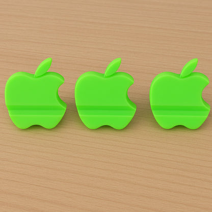 Assorted color apple-shaped mobile phone stands displayed together