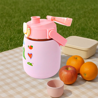 Outdoor setting featuring insulated stainless steel water bottle with handle