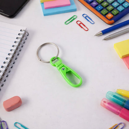 Mix colour mini plastic carabiner keychain securely clipped to a backpack.