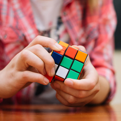 A Rubik's Cube viewed from a slight angle, emphasizing its bright, colorful squares and durable ABS plastic construction.