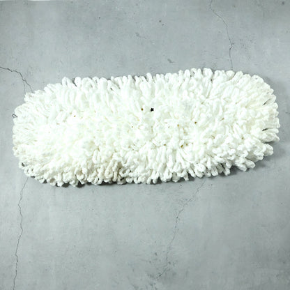 Freshly washed dust mop refill head drying naturally.