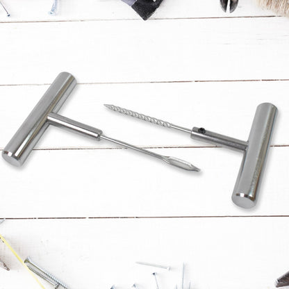 Tyre repair kit tools shown in hand for scale and easy handling.