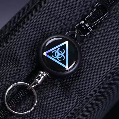 Retractor key chain with steel cable, showcasing its robust build quality.