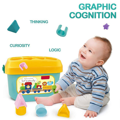 Child sorting a yellow star block into the Baby Shape Sorter bucket, developing motor skills.