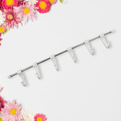 The strong adhesive 'magic stickers' used for secure, nail-free mounting of the utensil hanger rail.