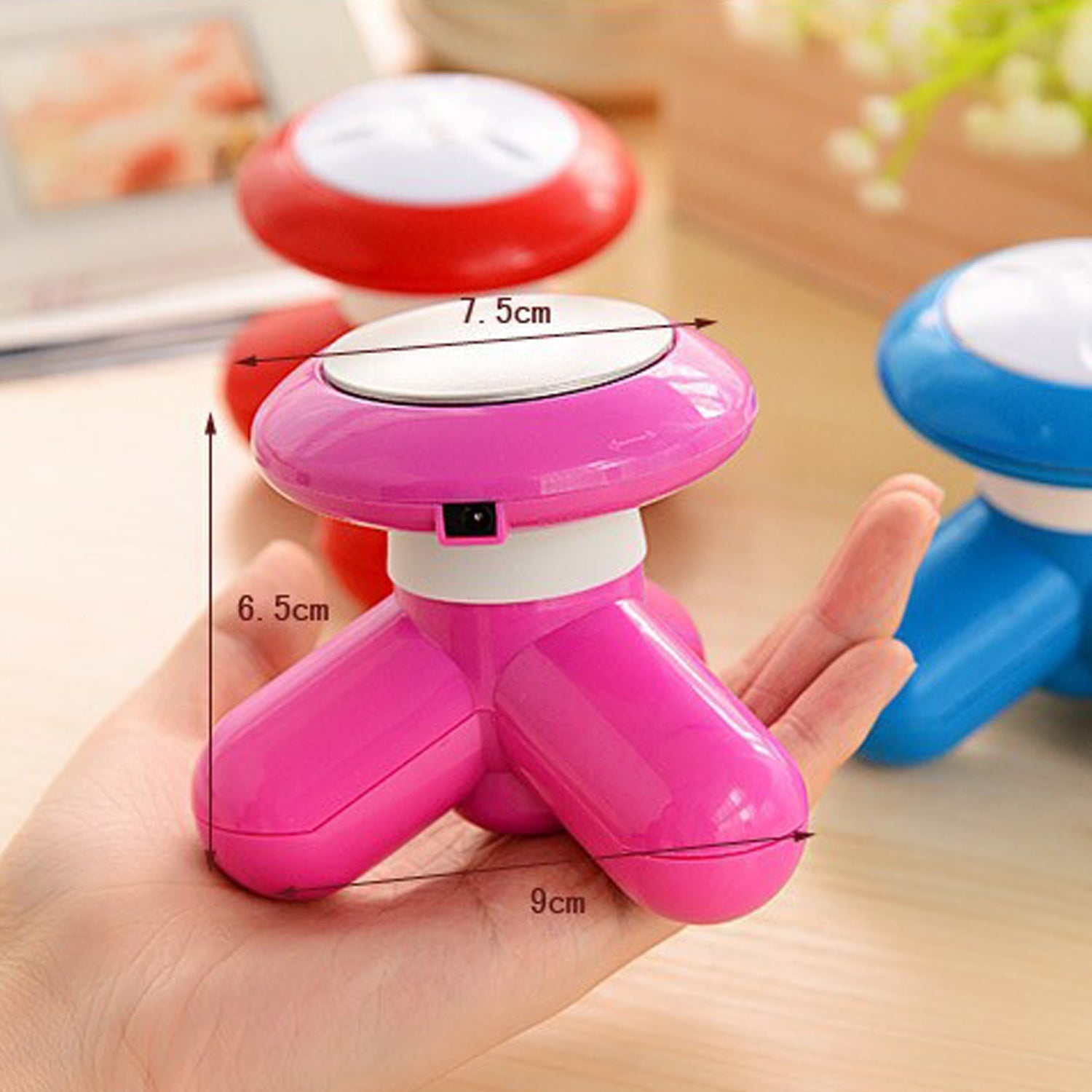 Hand holding the easy-to-use USB massager for stress relief.