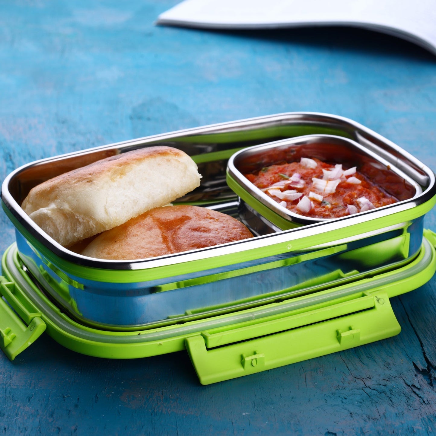 Durable Ganesh Stainless Steel Lunch Box with multiple compartments shown open.