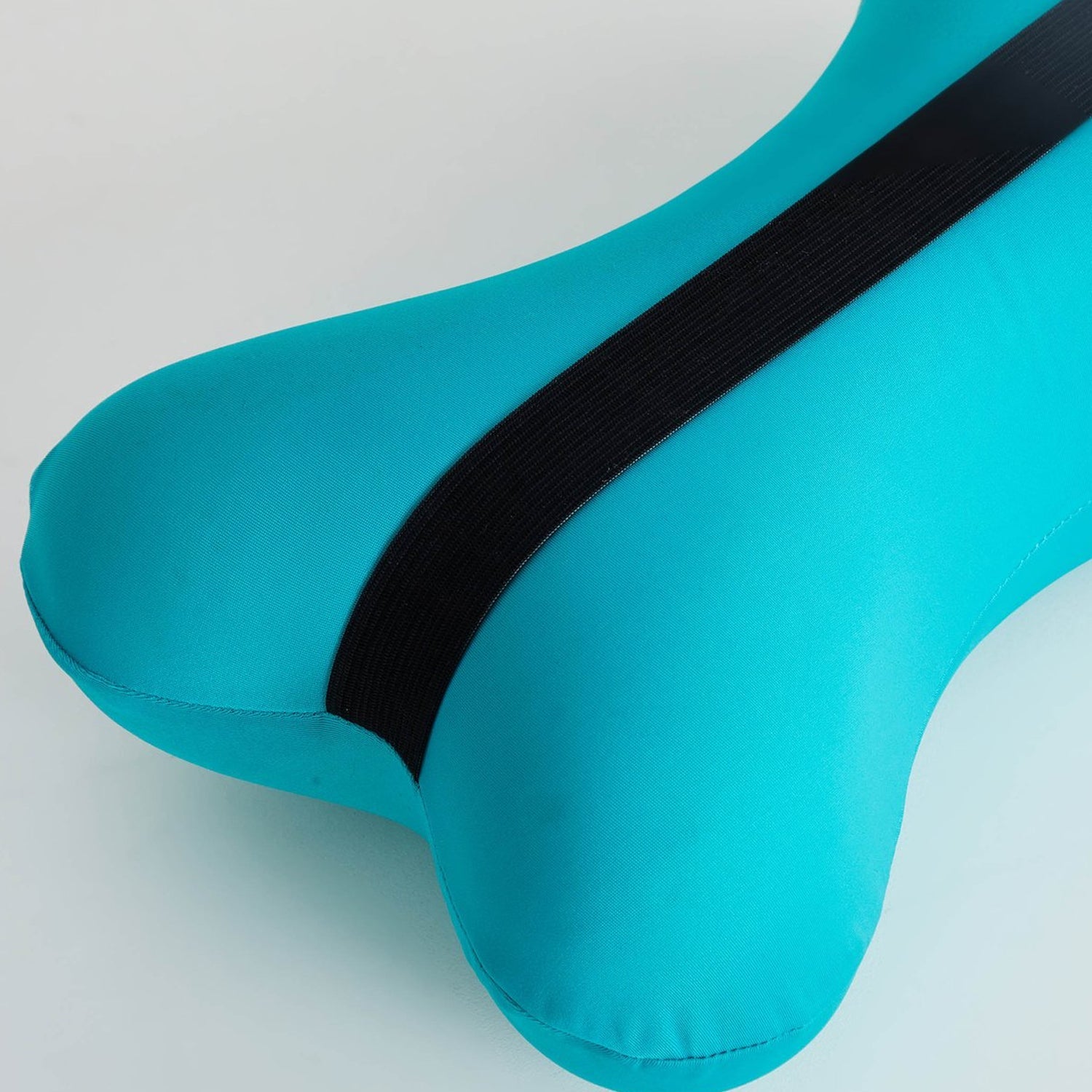 Side view showcasing the bone-type design of the travel neck pillow.