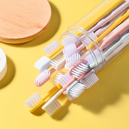 Single soft plastic toothbrush held, demonstrating its comfortable grip and flexible design.