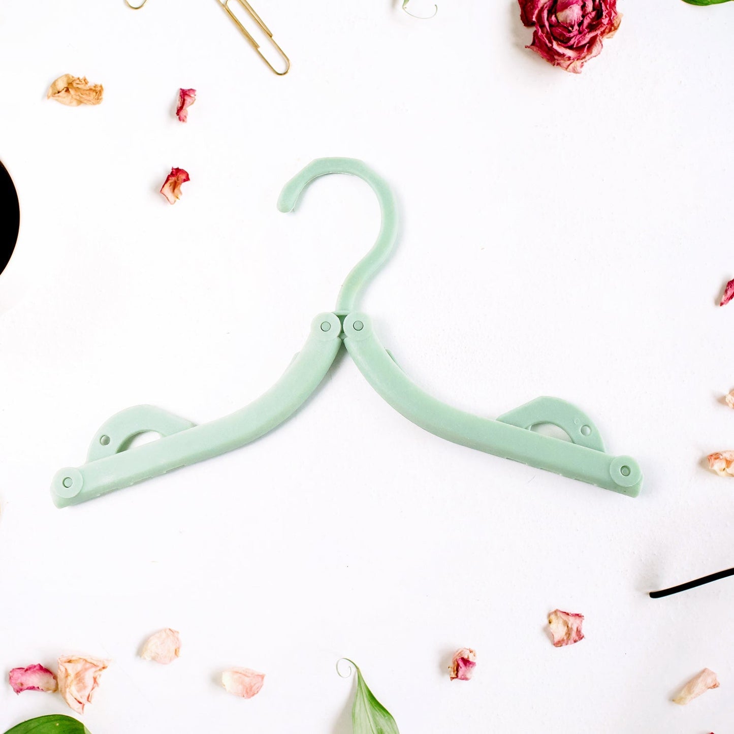 Camping with foldable travel hangers holding clothes securely