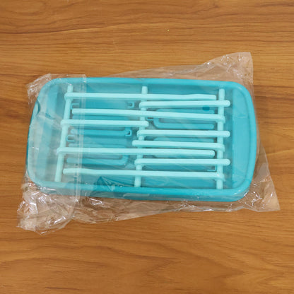 Side view of baby feeding bottle drying rack on kitchen countertop
