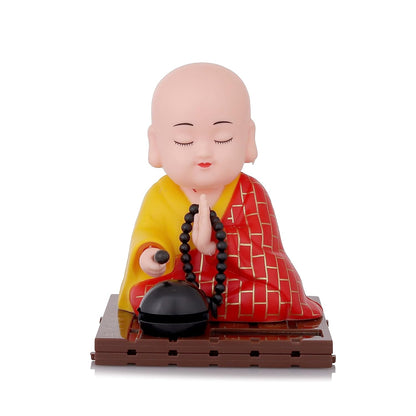 A smiling solar Buddha statue, bringing positive energy to any space.