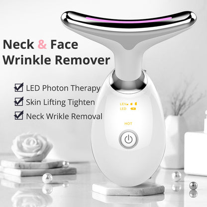 Electric face massager with LED lights in hand