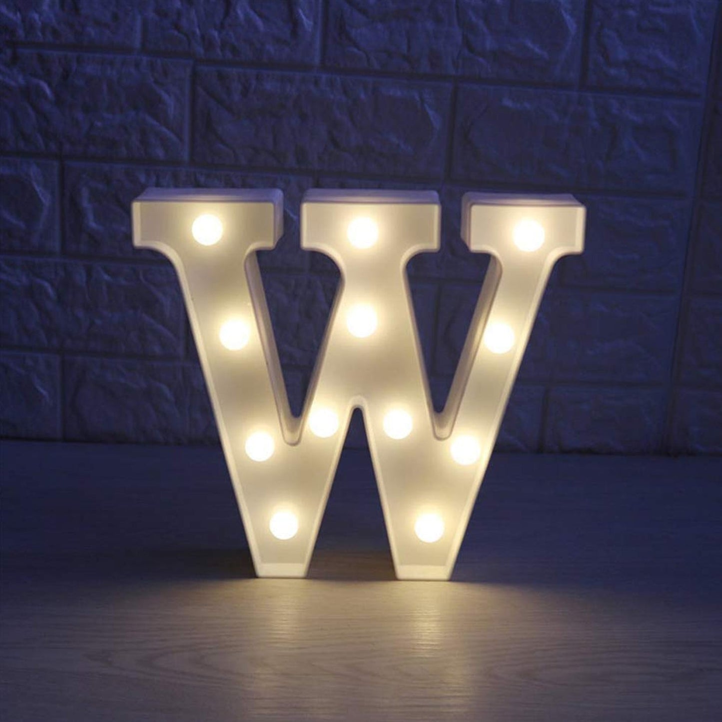 Pink silhouette W shaped LED night light used as mood lighting
