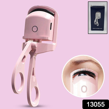 Close-up of the Electric Heated Eyelash Curler comfortably held in hand.