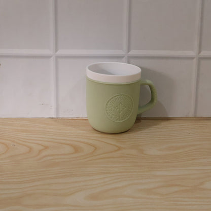 Close-up detail of the textured leather finish on the plastic mug