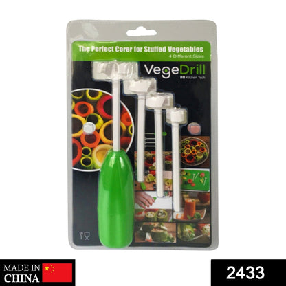 Hand using the vegetable corer tool to hollow out a green vegetable.