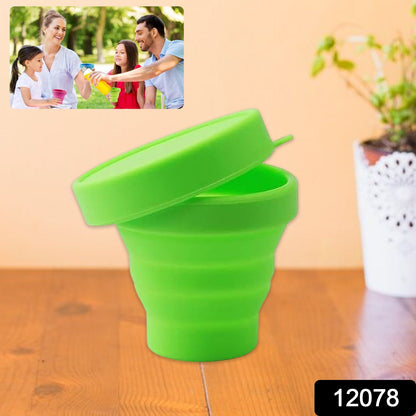Silicone foldable travel mug used outdoors, ideal for camping or hiking.