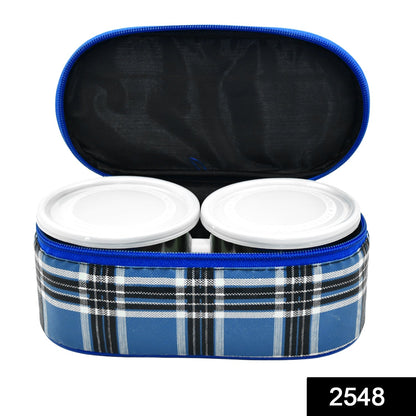 Three round stainless steel tiffin containers neatly stacked.