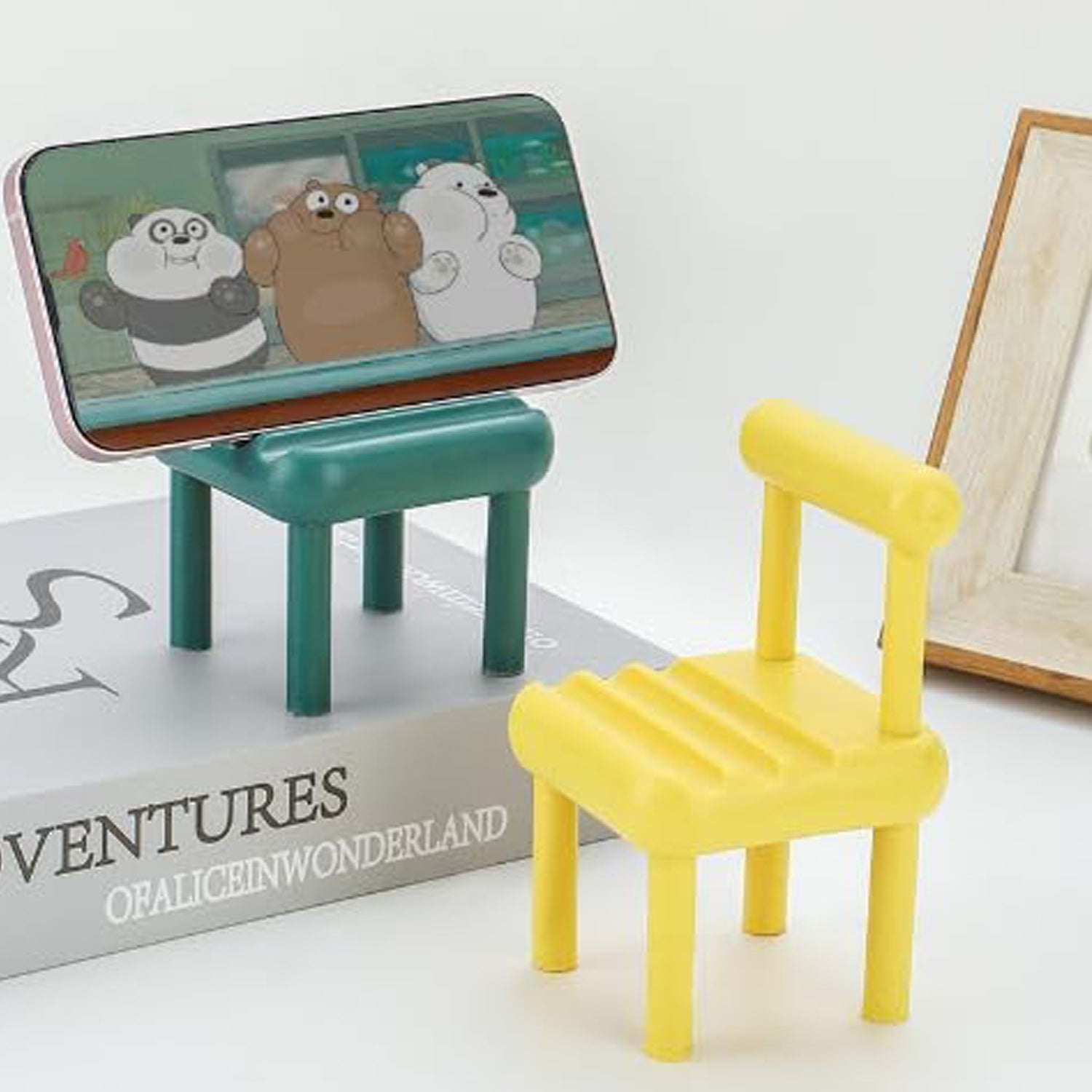 PHOBIA Mini Chair Phone Stand made from beech wood on a desk.
