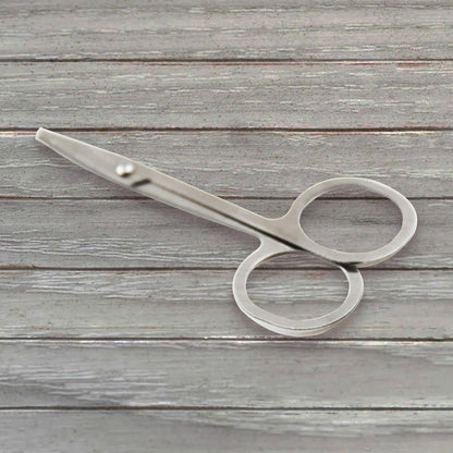 Elegant compact nail clipper set with its clear storage case for easy access.
