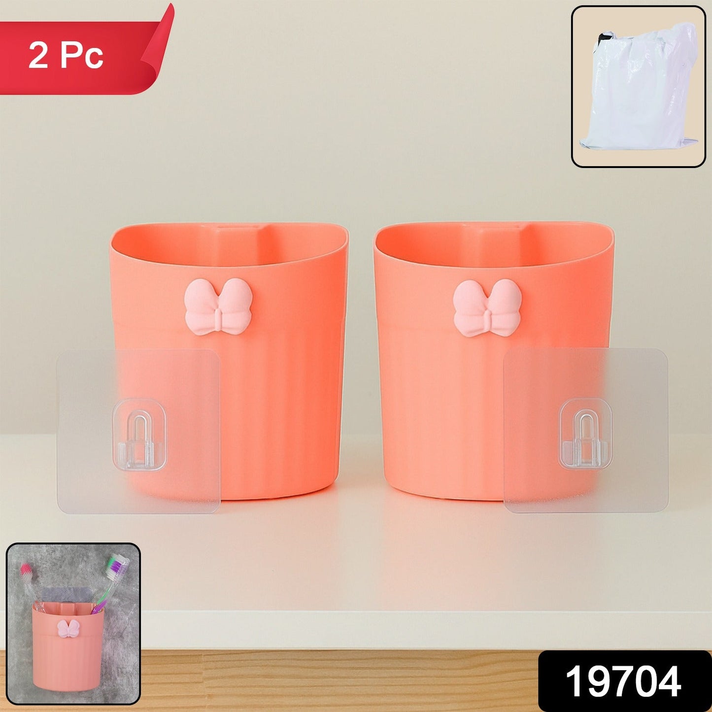 Two-piece set of wall-mounted toothbrush holders featuring butterfly design in original packaging