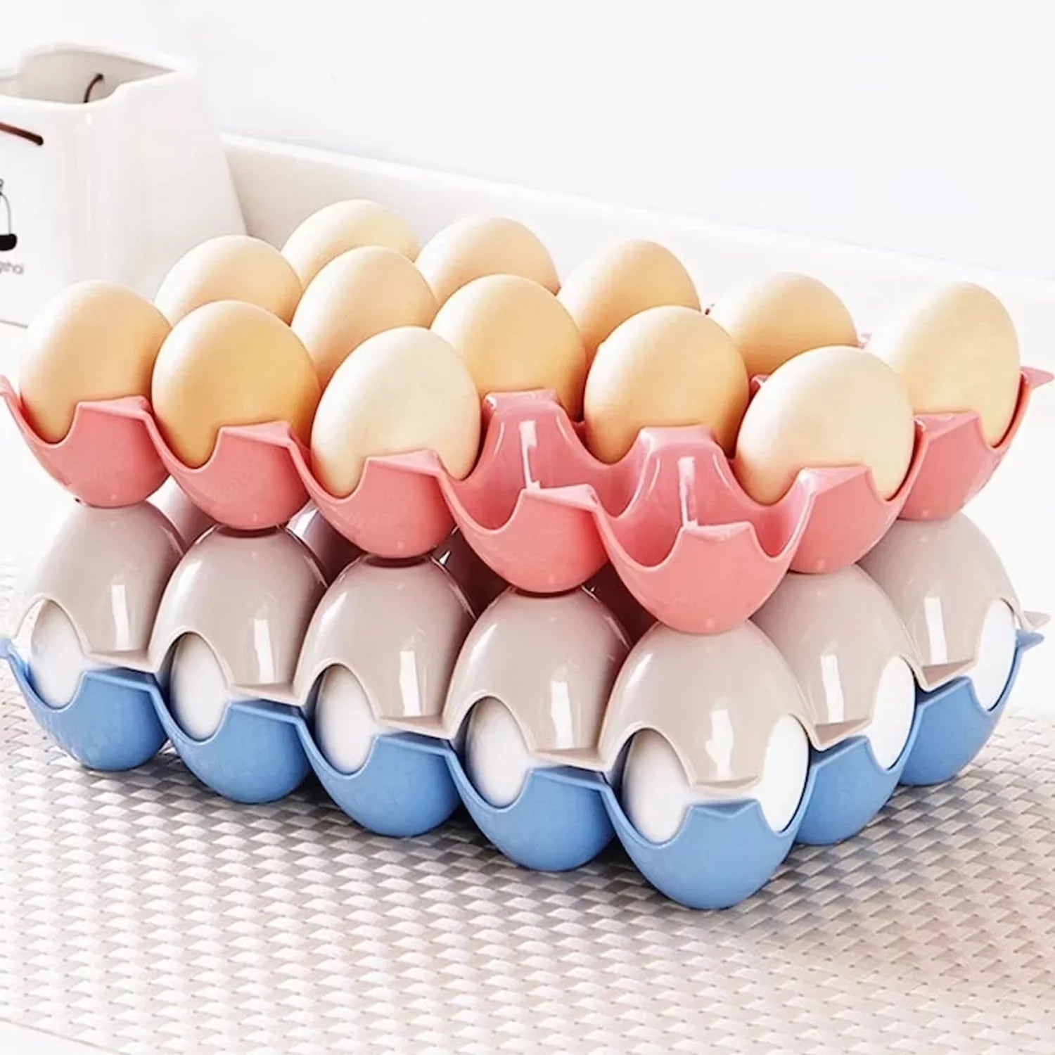 Set of four 15-cavity plastic egg trays for organised fridge storage.