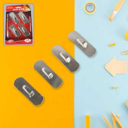 Versatile sticky hooks organizing kitchen utensils on a tiled wall, freeing up counter space.