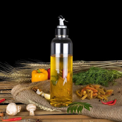 Clear plastic oil dispenser, 1 litre, with lid and drip-free spout.