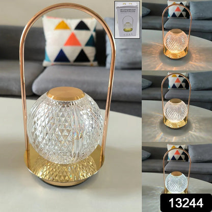 Elegant rechargeable LED lamp with a golden base and acrylic shade.