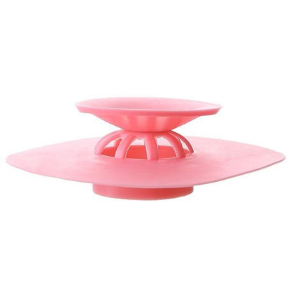 Silicone drainer cover placed on kitchen sink for clog prevention