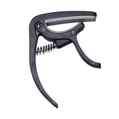 Wagtail guitar capo securely clamped on an acoustic guitar neck.