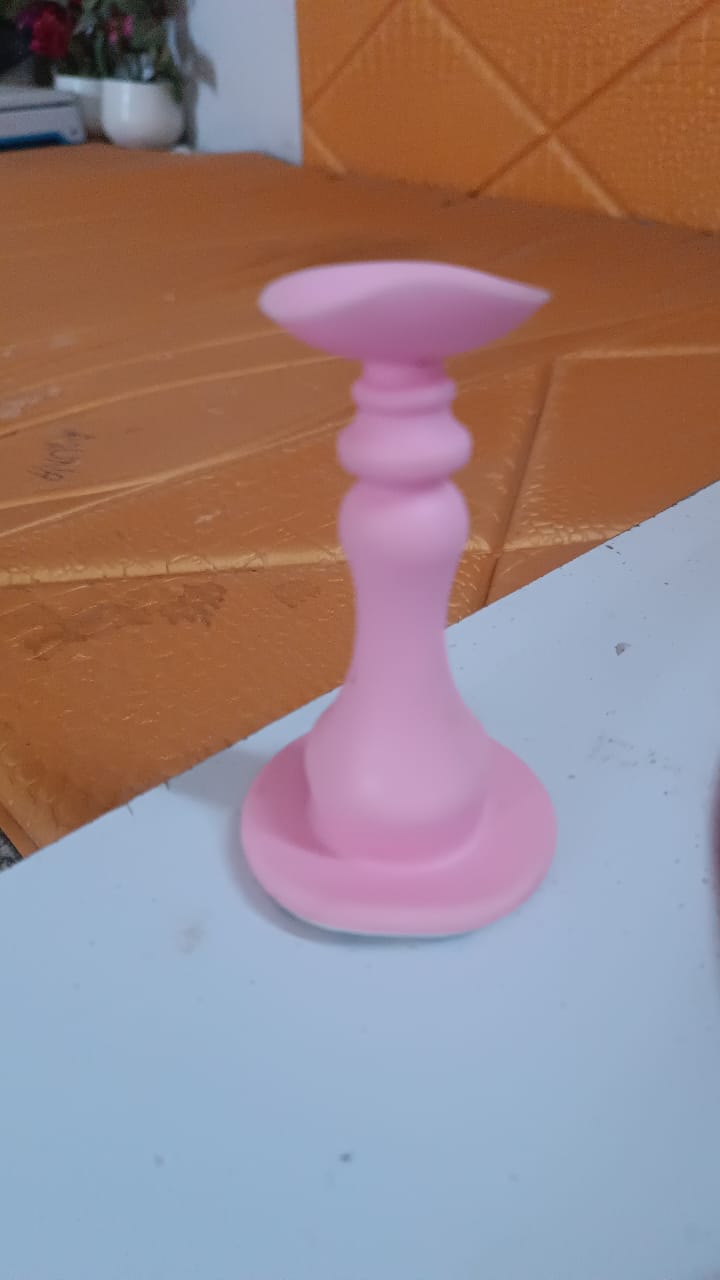 Washing machine door holder placed on white background showing suction cup