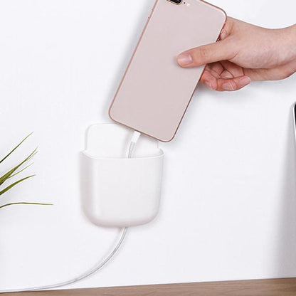 Side view of a mobile phone charging in the wall mounted stand, highlighting the bottom charging port.