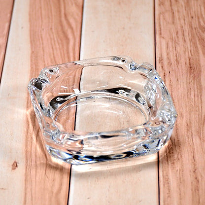 Versatile glass ashtray designed for both indoor and outdoor environments.