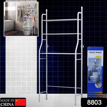 Close-up of the metal over toilet storage rack with toiletries and towels, highlighting its functionality.
