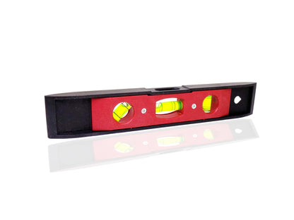 Close-up of the 3 bubble level vials on the portable measuring tool.