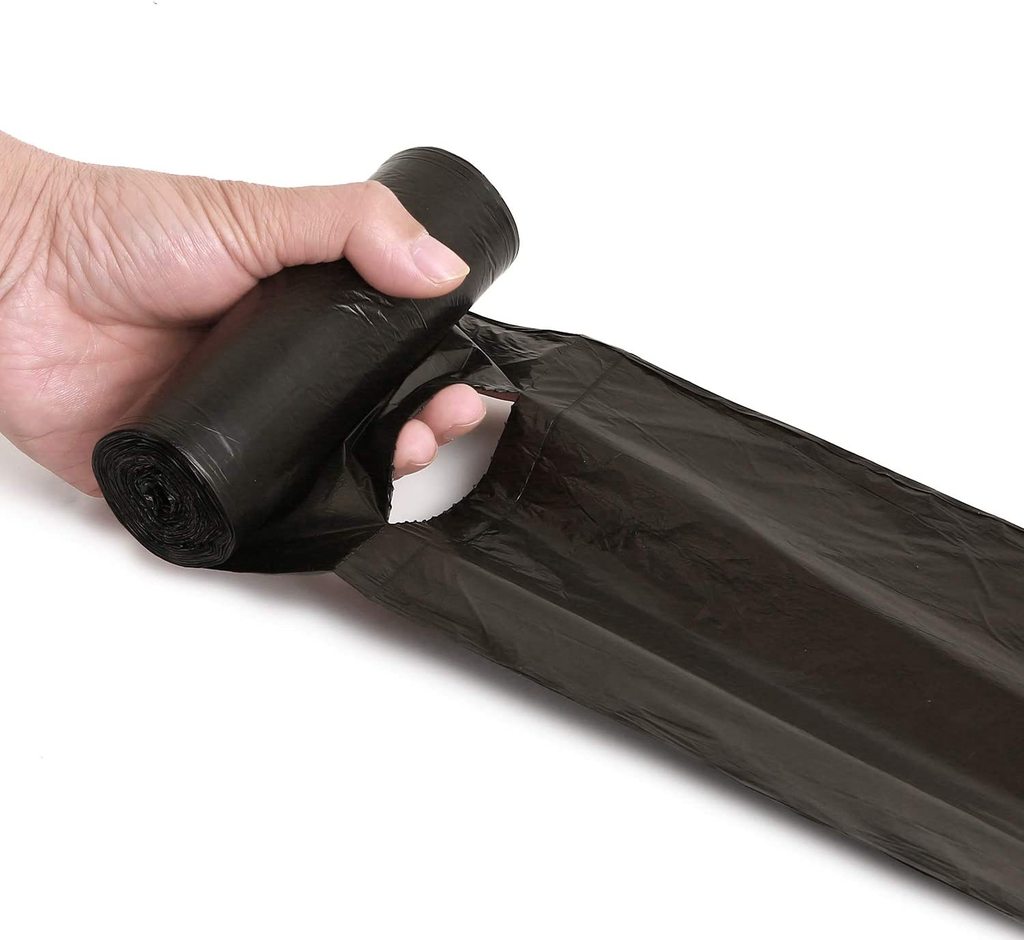 Rolled up FERVENT medium black garbage bag (24x32 inches) for everyday use.