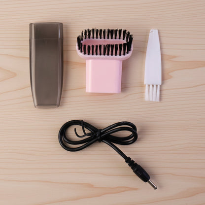 Compact vacuum cleaner with brush attachment in use