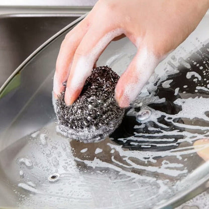 Close-up of a robust stainless steel scrubber, ideal for tough kitchen cleaning.
