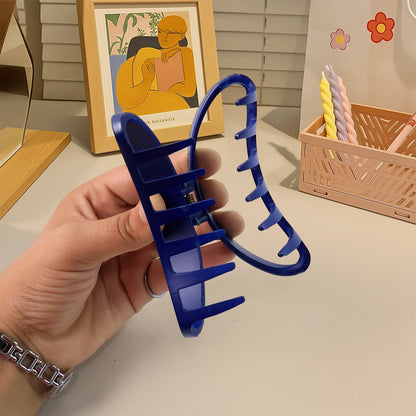 Hair clip holding hair back during face washing, plastic matte claw clip