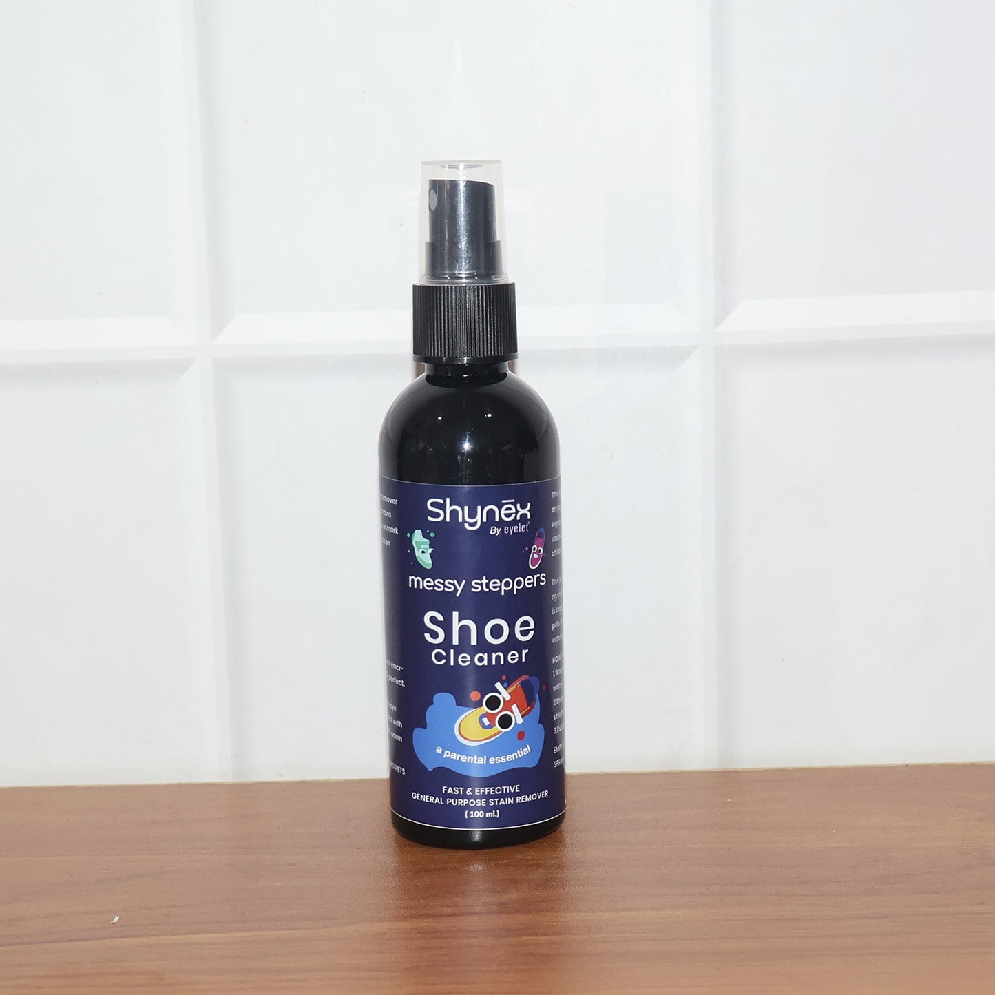 Person applying Shoe Cleaner Spray on sneakers for quick cleaning