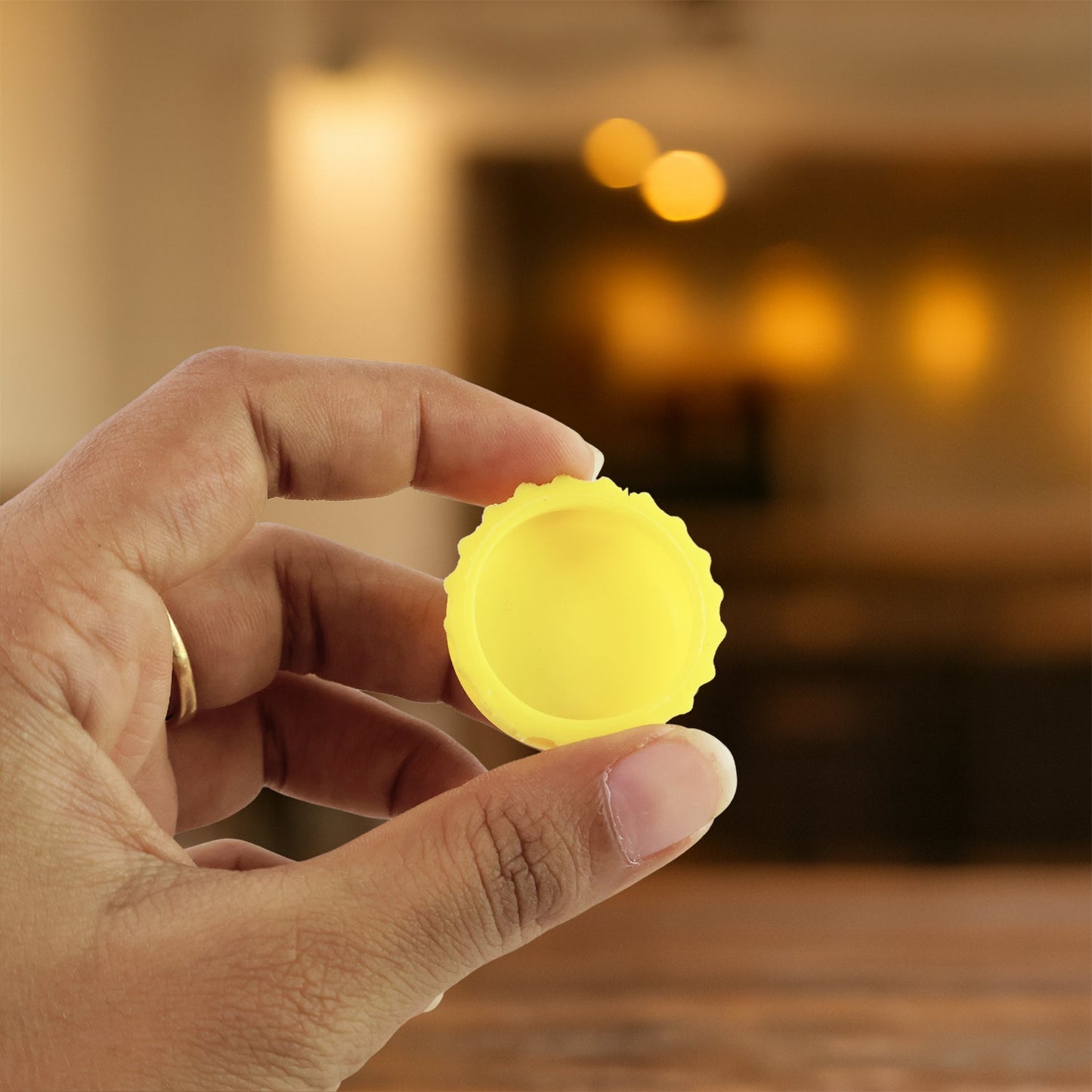 Silicone bottle cap cover displayed