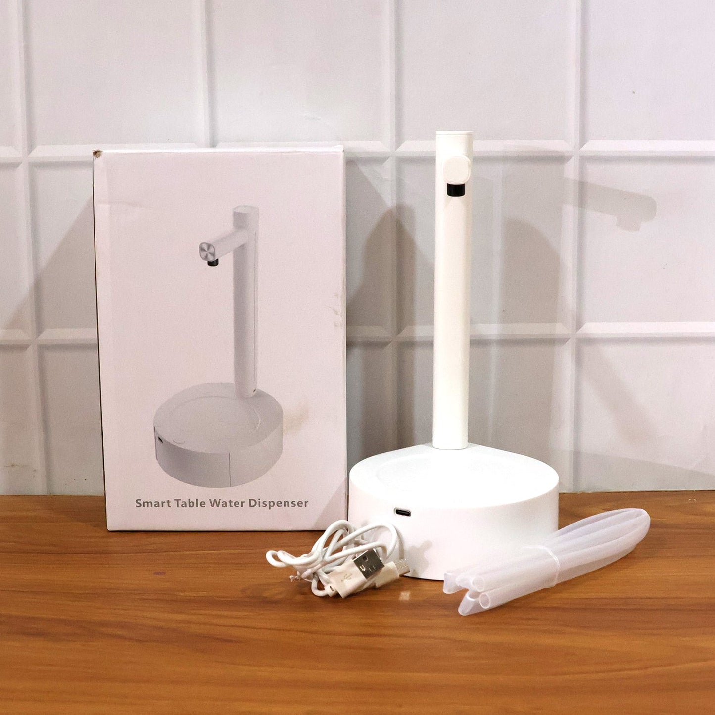 A refreshing stream of water being dispensed by the automatic water dispenser into a cup.