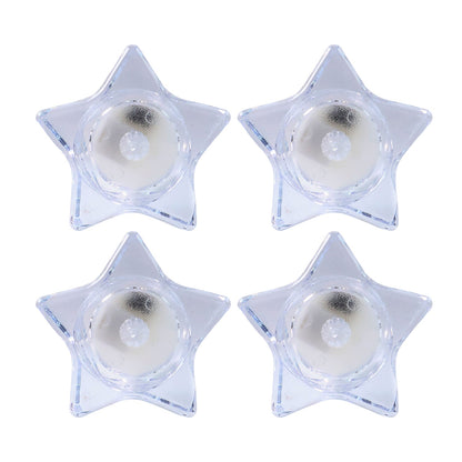 Flameless LED candles shaped like stars providing ambient light