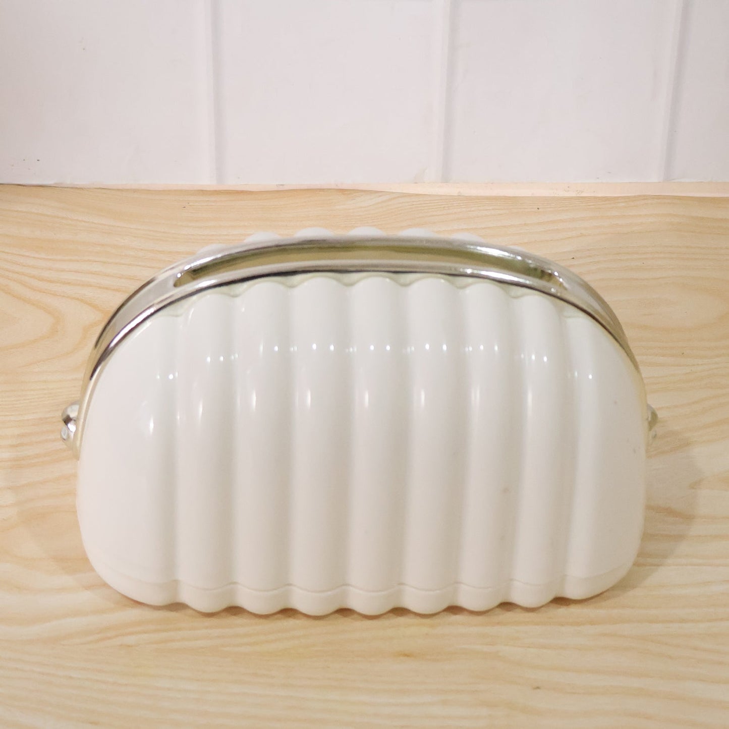 White shell style tissue dispenser front view