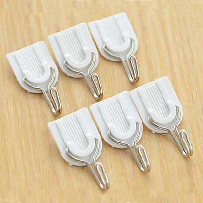 Damage-free self-adhesive hook securely holding multiple towels.