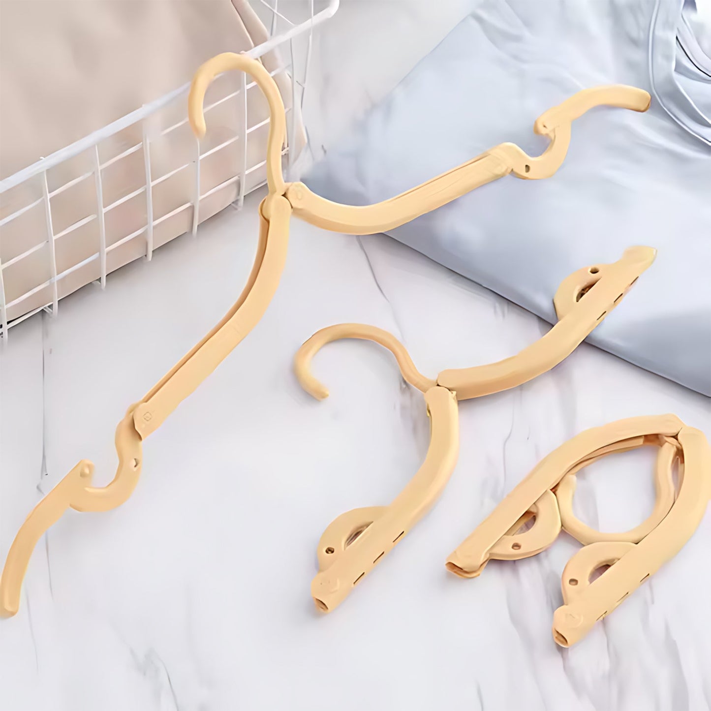 Portable folding hanger with rotating hook ideal for travel and home use